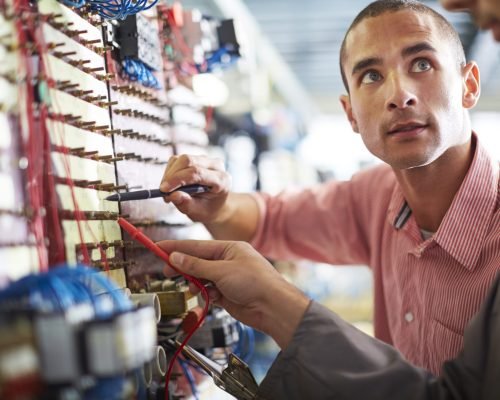 Two electricians at work